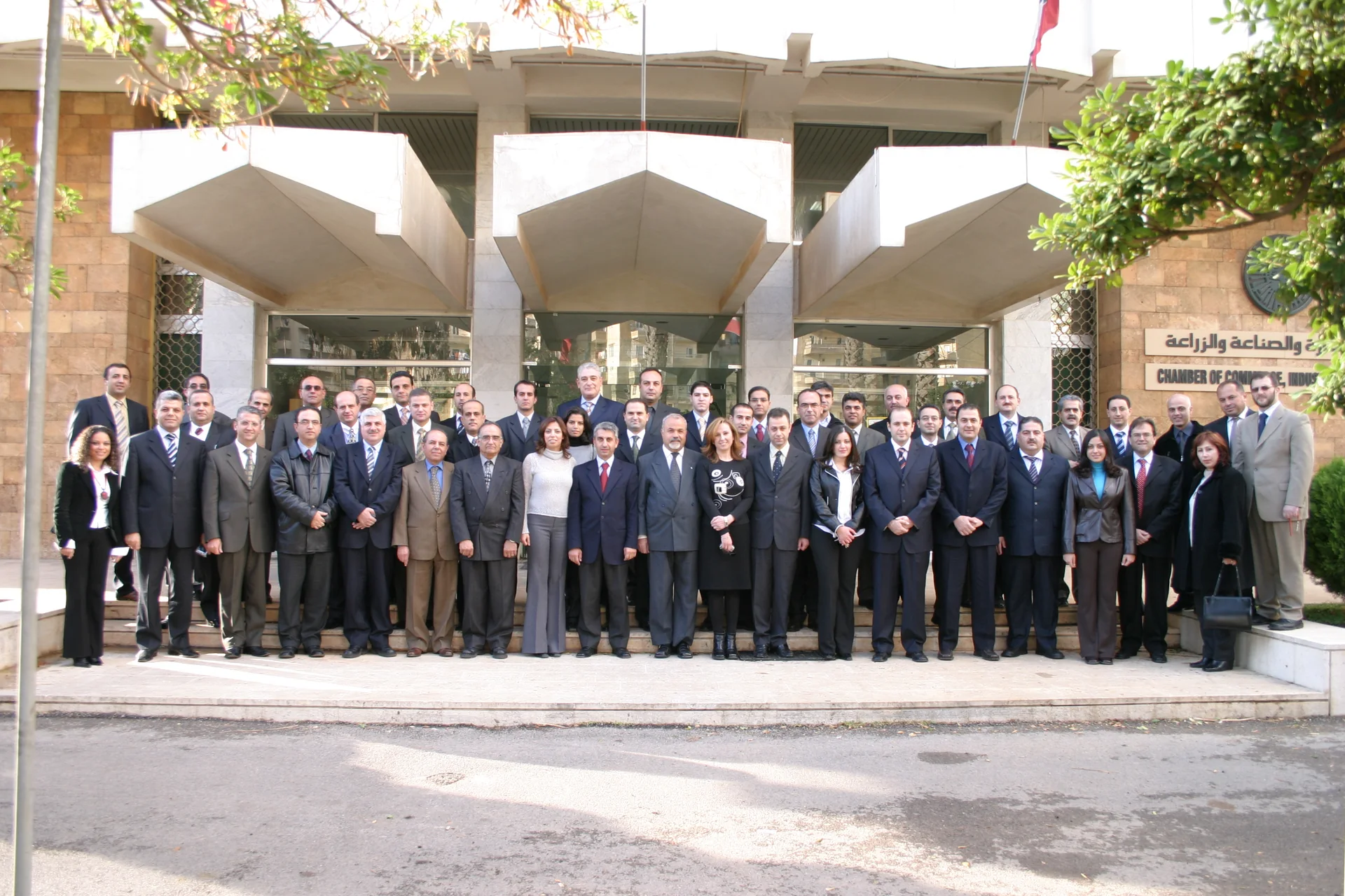 A large group of Headway professionals gathered outside a chamber of commerce